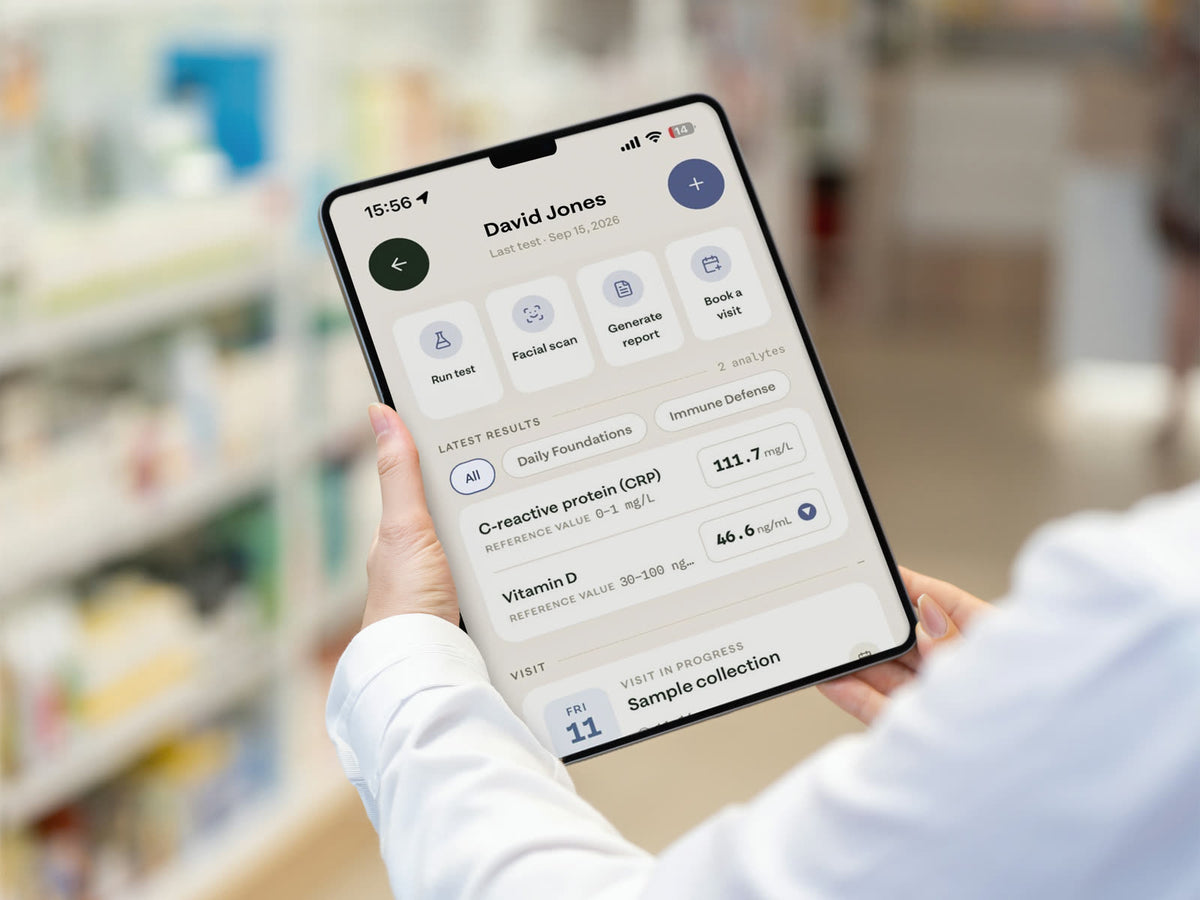 A pharmacist using the welleo Professional app on a tablet